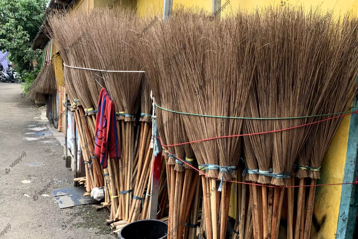 Broomsticks are prepared for shipment to customers.